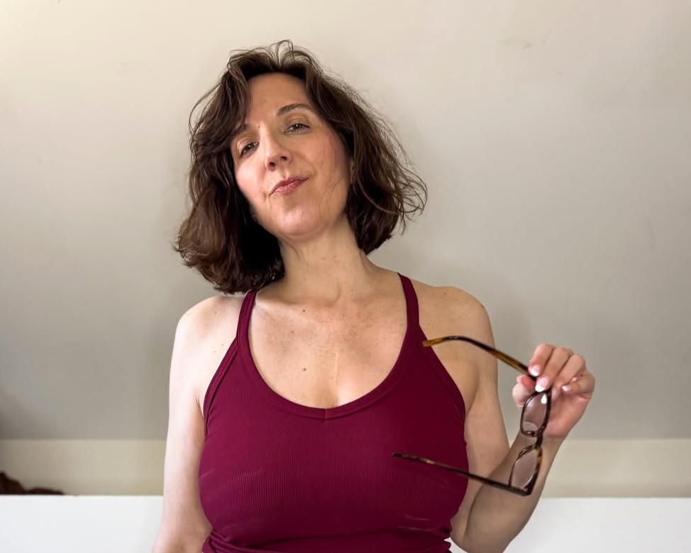 Mistress Tease wearing a red bra top