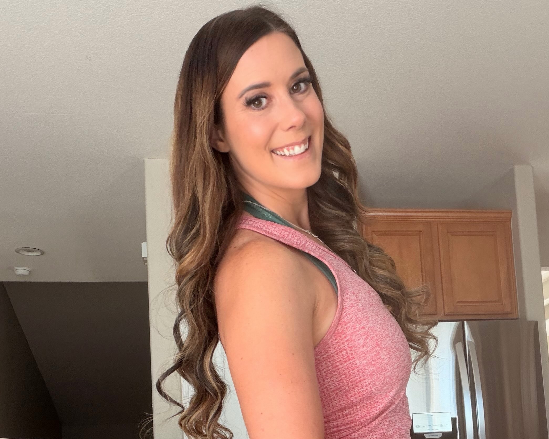 Gracie Montana wearing a pink tank top
